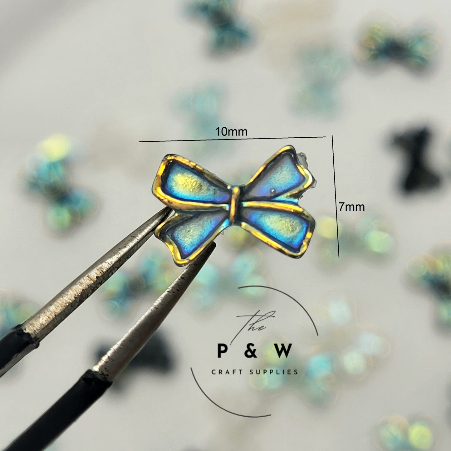 N 59 - Iridescent Bow Nail Charms D